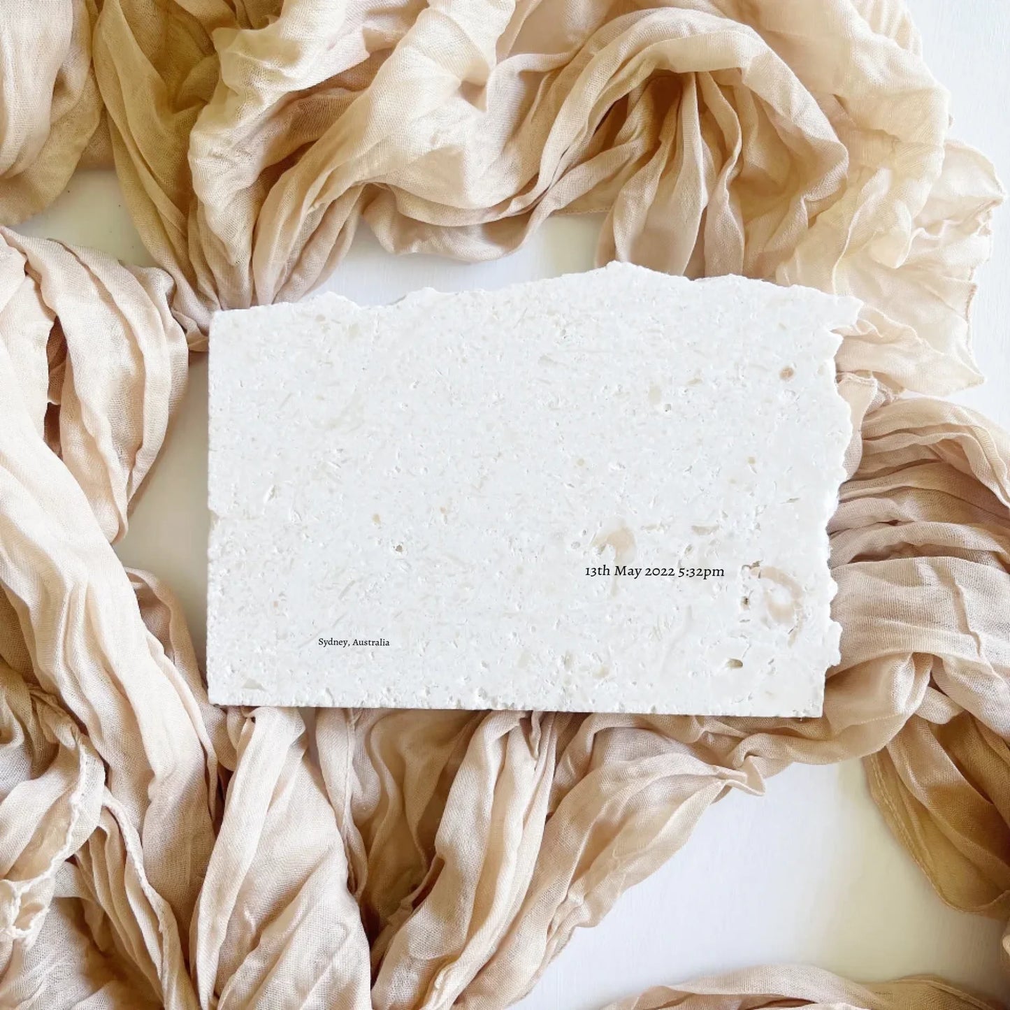 Limestone celestial baby keepsake in landscape style.