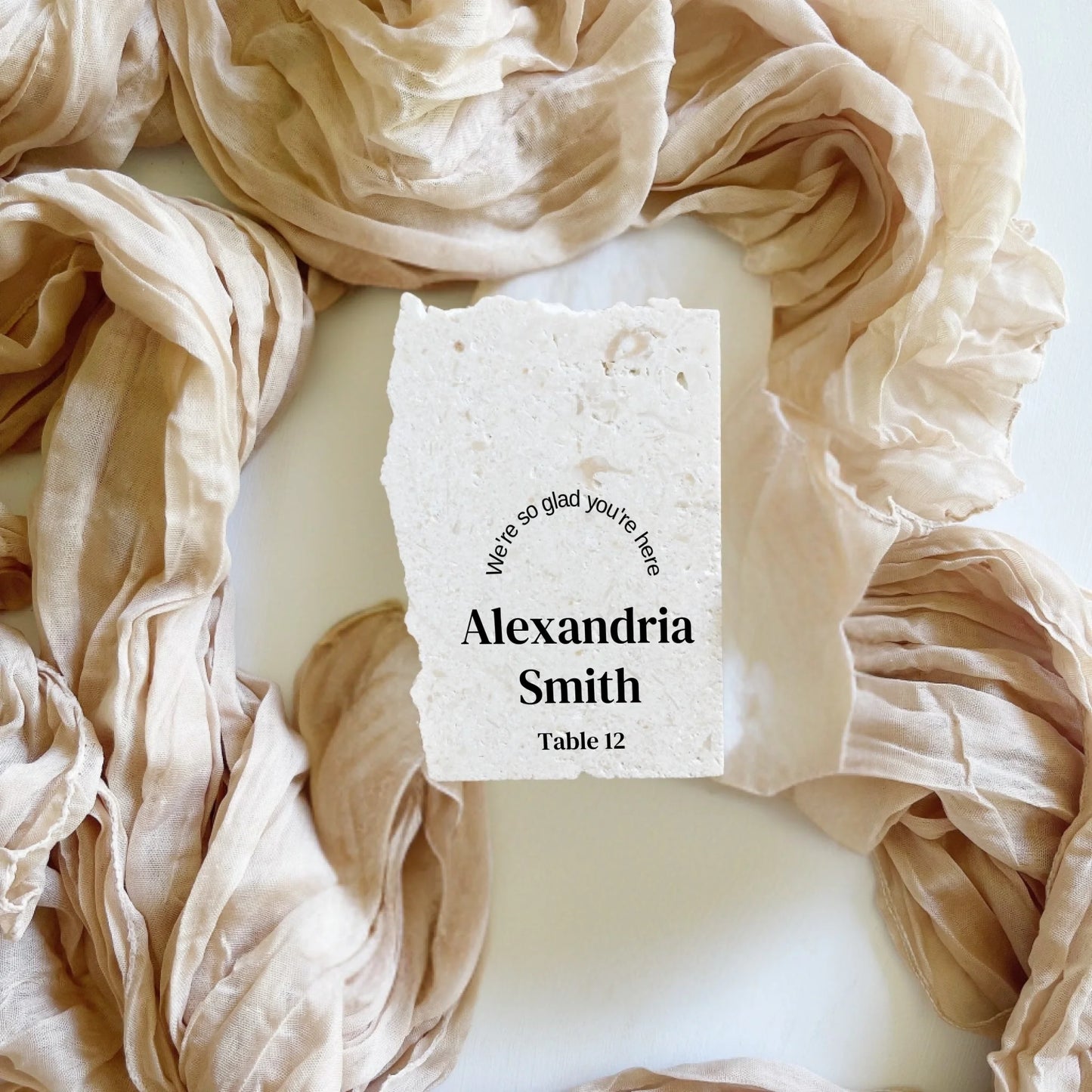 Limestone place cards in portrait style, personalised with name, number, styled for weddings, events.
