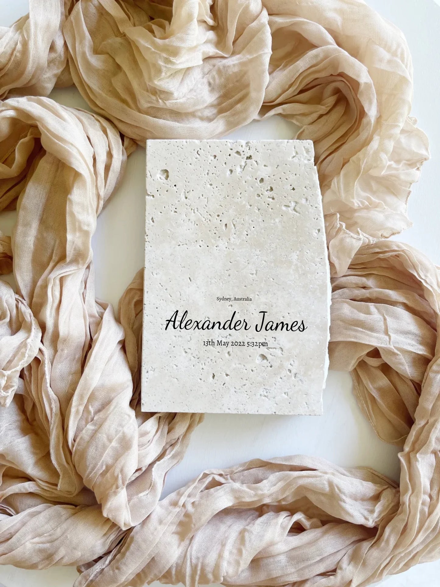 Travertine celestial baby keepsake in portrait style.